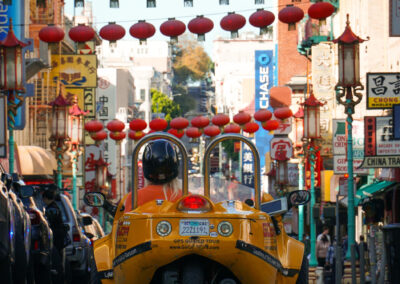 Gocar passing under Chinese lanterns in Chinatown San Francisco