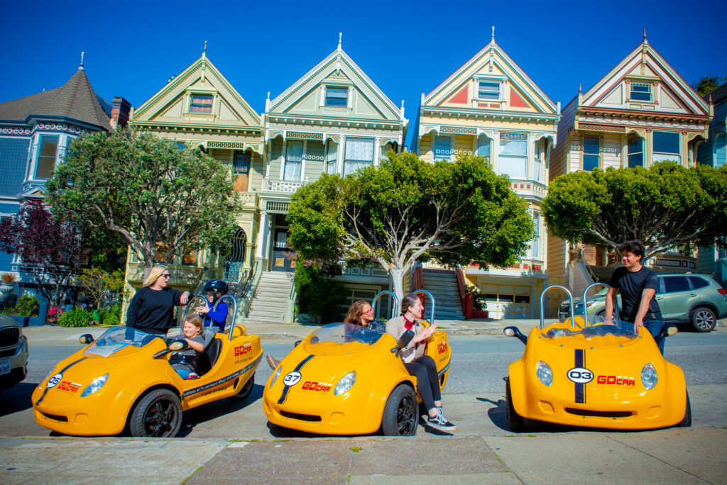 gocars parked in front of the Painted Ladies in San Francisco