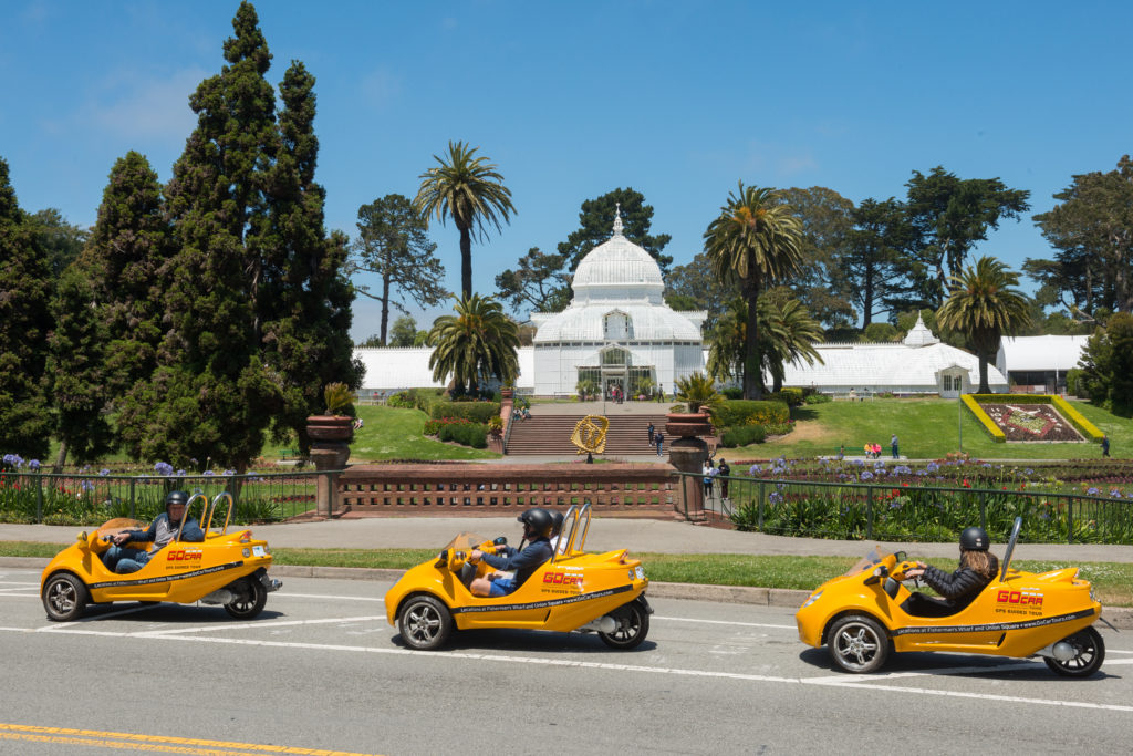 Three GoCars driving on a Golden Gate Park Tour