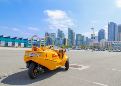 Back view of GoCar Parked in front of San Diego Cityscape