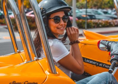 Smiling driver wearing sunglasses on a GoCar Tour