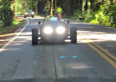 Front View of a Vanderhall Blackjack Car Driving to Julian