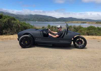 Vanderhall Car Parked Near a Body of Water on the Way to Julian
