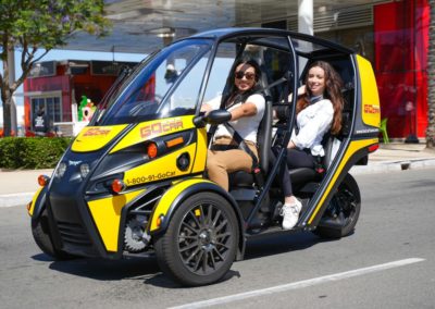 two young women in a gocar