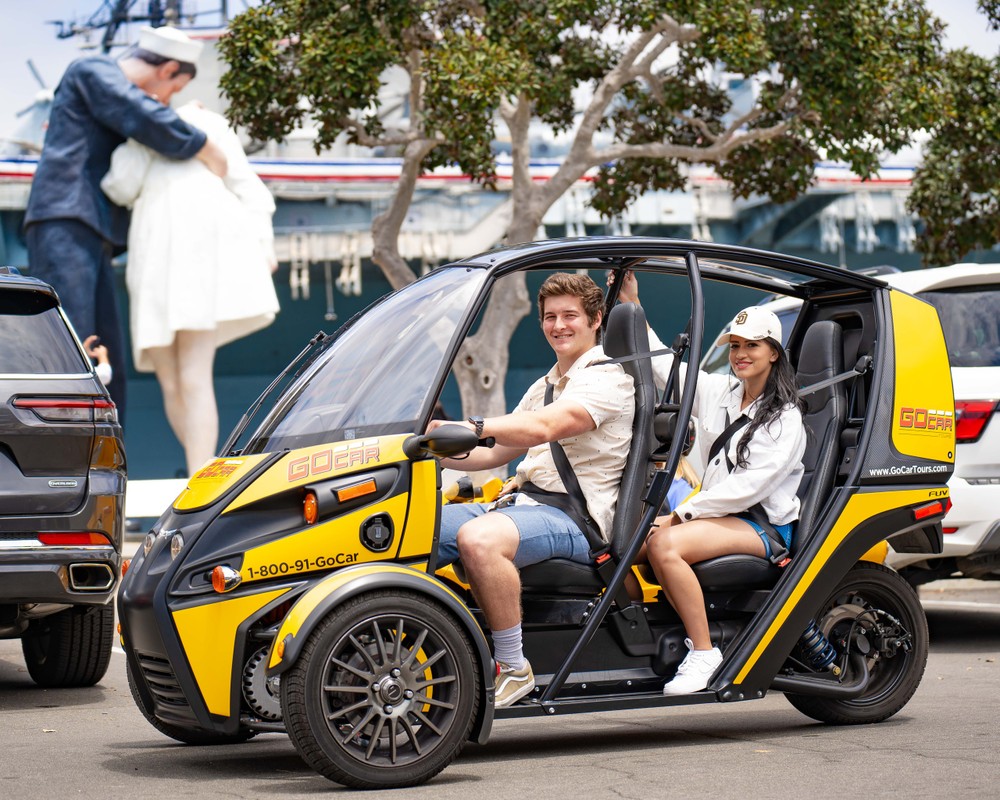 people driving a gocar