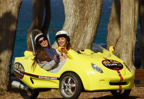 Two women enjoying a GoCar Monterey Tour