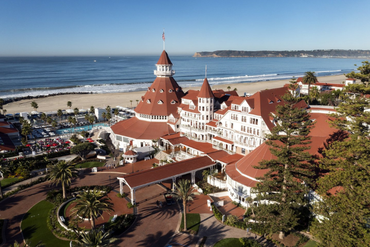 Aerial view of the Hotel Del Coronado in San Diego, CA with the ocean in the background